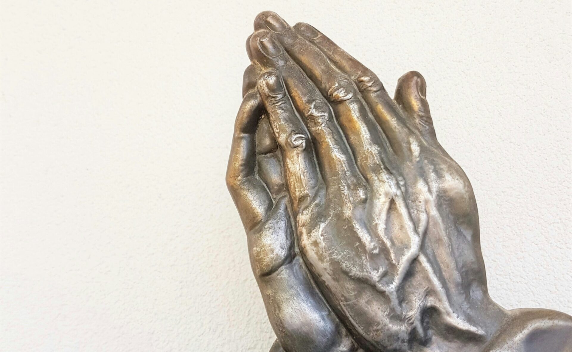 Photo by <a href="https://unsplash.com/@fin777?utm_source=unsplash&utm_medium=referral&utm_content=creditCopyText">Deb Dowd</a> on <a href="https://unsplash.com/photos/gray-praying-hand-statue-IaCswSJ__uc?utm_source=unsplash&utm_medium=referral&utm_content=creditCopyText">Unsplash</a> 